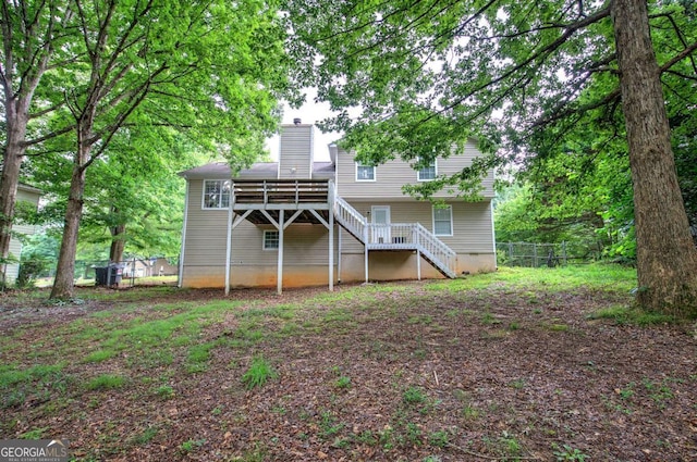 62 Lazy Water Dr SW, Cartersville, GA 30120 - back of house featuring stairs, a chimney, and a deck