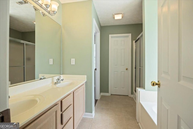 7825 Running Fox Trl, Gainesville, GA 30506 - bathroom with a shower stall, double vanity, a textured ceiling, tile patterned floors, and a garden tub