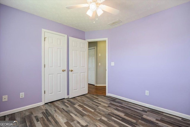7825 Running Fox Trl, Gainesville, GA 30506 - unfurnished bedroom featuring wood finished floors, ceiling fan, a closet, and a textured ceiling
