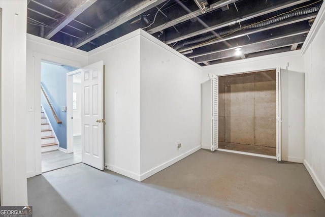 7825 Running Fox Trl, Gainesville, GA 30506 - below grade area with stairway and baseboards