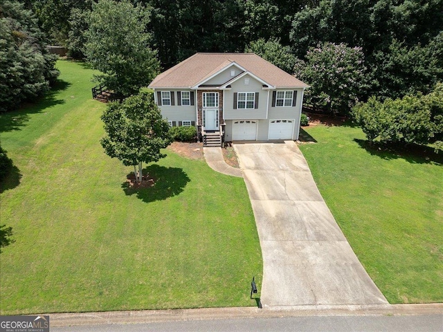 7825 Running Fox Trl, Gainesville, GA 30506 - bi-level home with concrete driveway, a garage, and a front yard