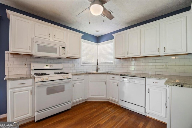 7825 Running Fox Trl, Gainesville, GA 30506 - kitchen with white appliances, ceiling fan, dark wood finished floors, and white cabinetry