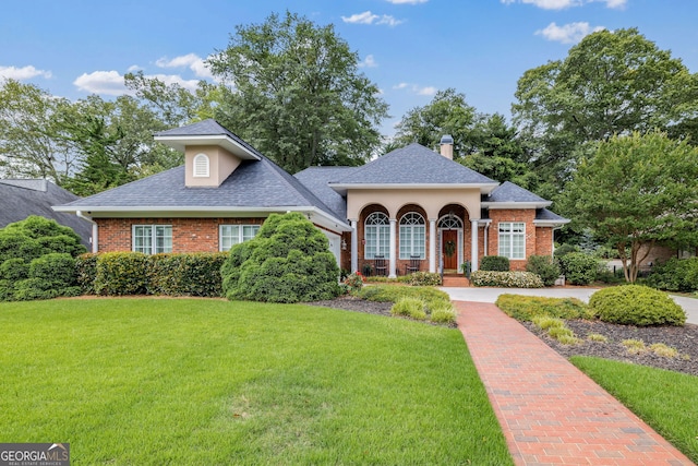 311 Vinings Walk, Gainesville, GA 30501 - view of front of home featuring brick siding, a front lawn, and a shingled roof
