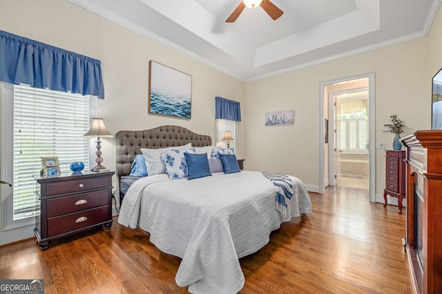 311 Vinings Walk, Gainesville, GA 30501 - bedroom with a raised ceiling, wood finished floors, ensuite bathroom, ceiling fan, and ornamental molding