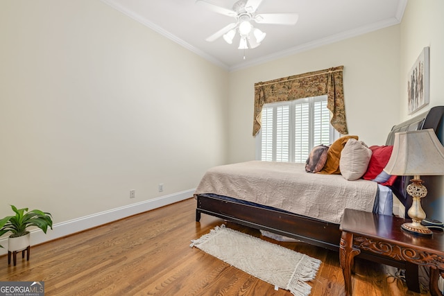 311 Vinings Walk, Gainesville, GA 30501 - bedroom with ornamental molding, wood finished floors, and a ceiling fan