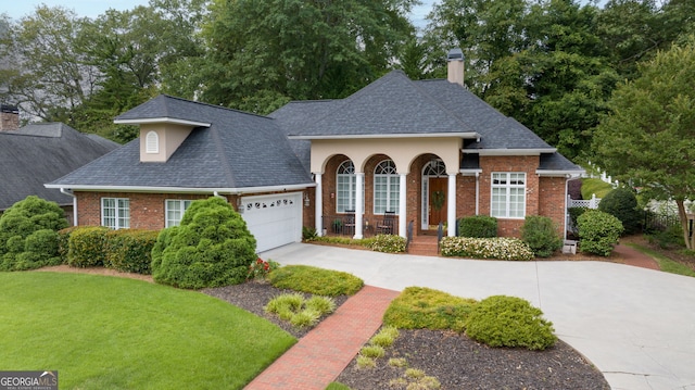 311 Vinings Walk, Gainesville, GA 30501 - view of front of house with a chimney, concrete driveway, a garage, brick siding, and roof with shingles