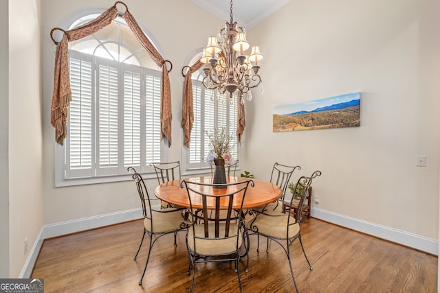 311 Vinings Walk, Gainesville, GA 30501 - dining space featuring a chandelier, crown molding, and wood finished floors