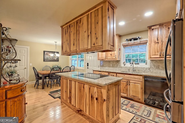 4505 Mccullum Trl, Hiawassee, GA 30546 - kitchen with a sink, black appliances, a kitchen island, light wood-style flooring, and recessed lighting
