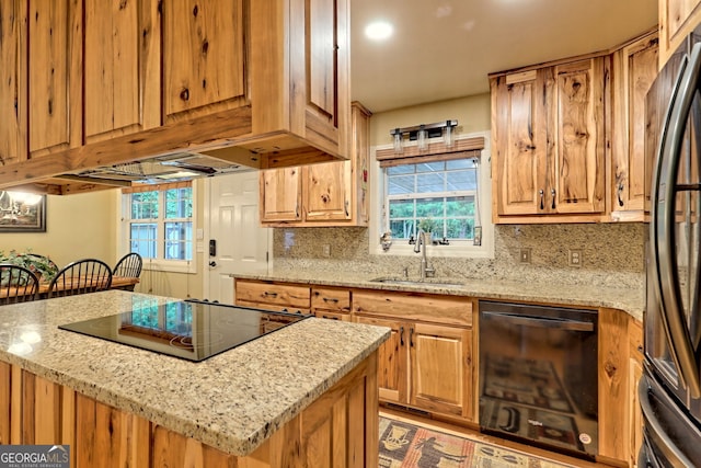 4505 Mccullum Trl, Hiawassee, GA 30546 - kitchen with dishwasher, a sink, cooktop, freestanding refrigerator, and backsplash