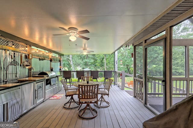 4505 Mccullum Trl, Hiawassee, GA 30546 - deck with outdoor dining space, a sink, and a ceiling fan