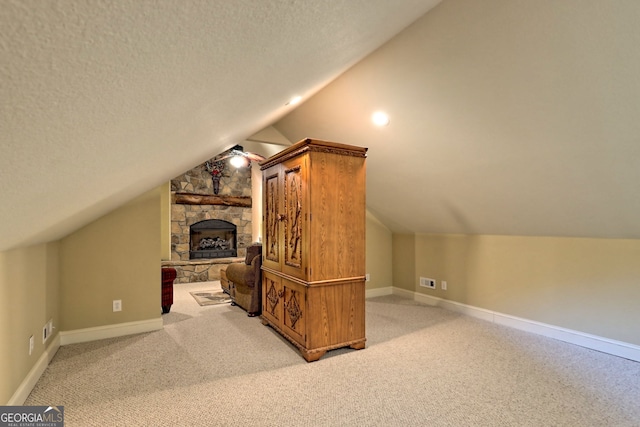 4505 Mccullum Trl, Hiawassee, GA 30546 - bonus room with vaulted ceiling, carpet, baseboards, a fireplace, and a textured ceiling