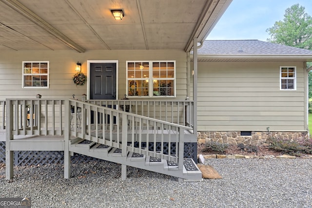 4505 Mccullum Trl, Hiawassee, GA 30546 - view of exterior entry featuring crawl space, a shingled roof, and a deck
