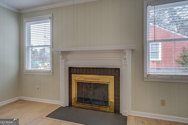 4131 Carroll St SW, Covington, GA 30014 - detailed view of wood finished floors, a fireplace, and ornamental molding