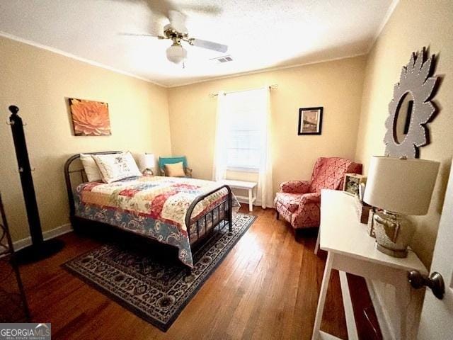 315 Clairborne Ave, Statesboro, GA 30458 - bedroom with wood finished floors, baseboards, ornamental molding, and ceiling fan