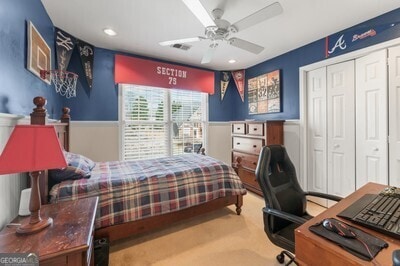 154 Hunters Trl, Dallas, GA 30157 - bedroom featuring wainscoting, carpet flooring, a closet, a desk, and ceiling fan