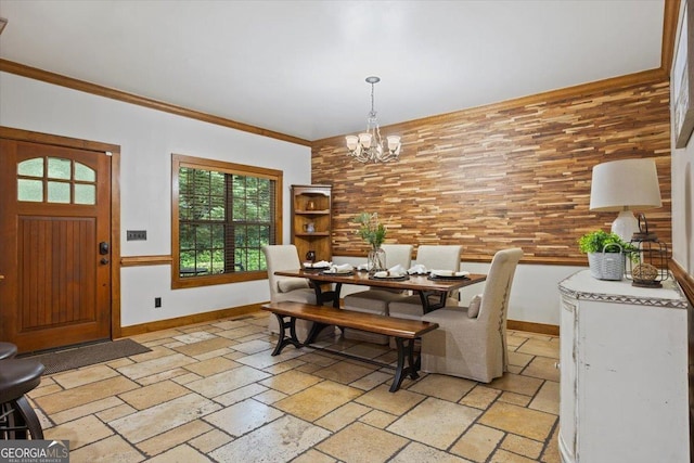 265 Shane Dr, Canton, GA 30115 - dining space featuring stone tile floors, a chandelier, and crown molding