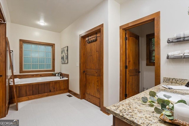 265 Shane Dr, Canton, GA 30115 - bathroom with vanity and a garden tub