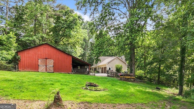 265 Shane Dr, Canton, GA 30115 - view of green lawn with a barn and an outdoor structure