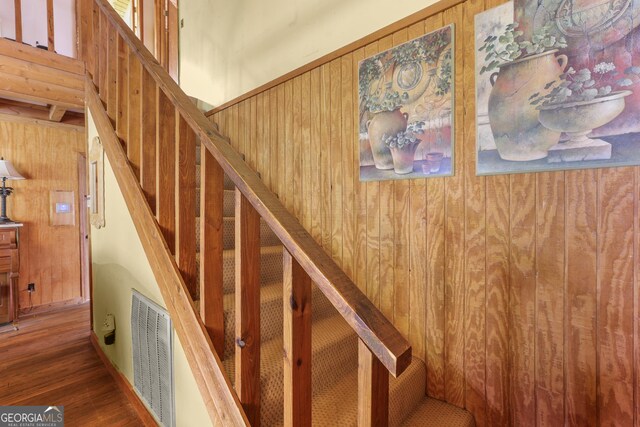 223 Arthur Rd, Zebulon, GA 30295 - stairs with wood finished floors, wooden walls, and baseboards