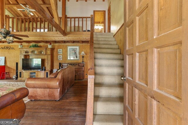 223 Arthur Rd, Zebulon, GA 30295 - living room featuring ceiling fan, a high ceiling, hardwood / wood-style floors, and stairway