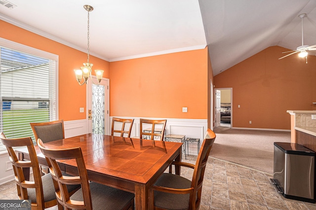 4200 Vinca Way, Union City, GA 30291 - dining room with a chandelier, stone finish flooring, ceiling fan, vaulted ceiling, and wainscoting