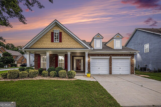 4200 Vinca Way, Union City, GA 30291 - view of front of home featuring a front yard, an attached garage, brick siding, and driveway