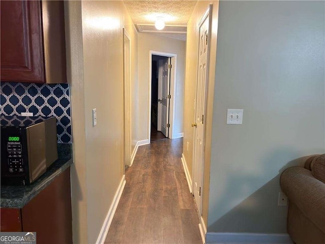 13 Hilltop St, Gainesville, GA 30501 - hall with dark wood finished floors, baseboards, and a textured ceiling