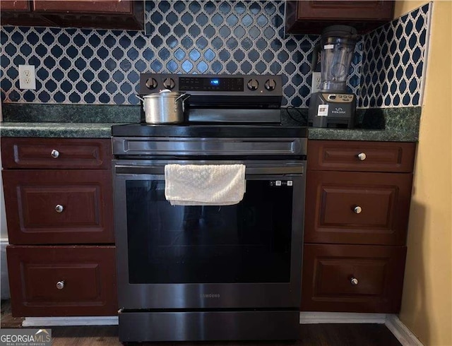 13 Hilltop St, Gainesville, GA 30501 - kitchen with electric range, dark countertops, and backsplash