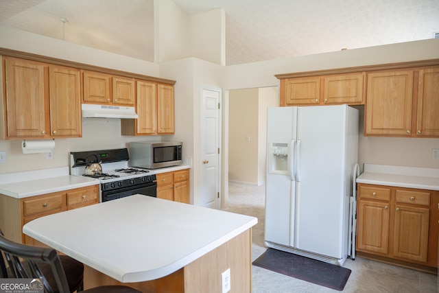 2407 Cove Lake Way, Lithonia, GA 30058 - kitchen with white refrigerator with ice dispenser, gas range oven, under cabinet range hood, stainless steel microwave, and a kitchen breakfast bar