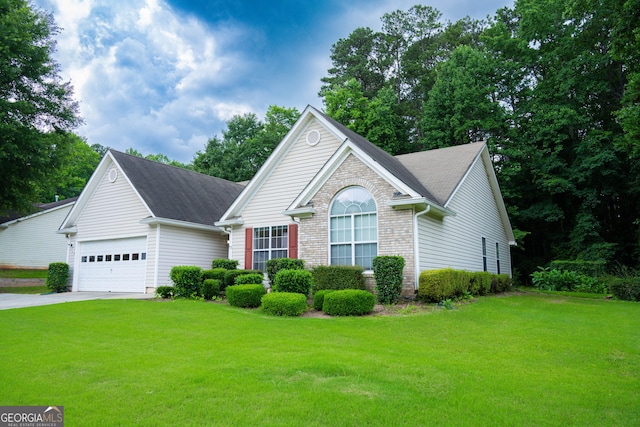 2407 Cove Lake Way, Lithonia, GA 30058 - view of front of house featuring an attached garage, a front lawn, driveway, and roof with shingles