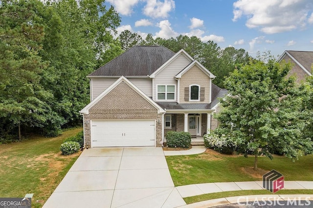 1015 Turtle Pond Dr, Watkinsville, GA 30677 - view of front of home with covered porch, a front yard, driveway, and brick siding
