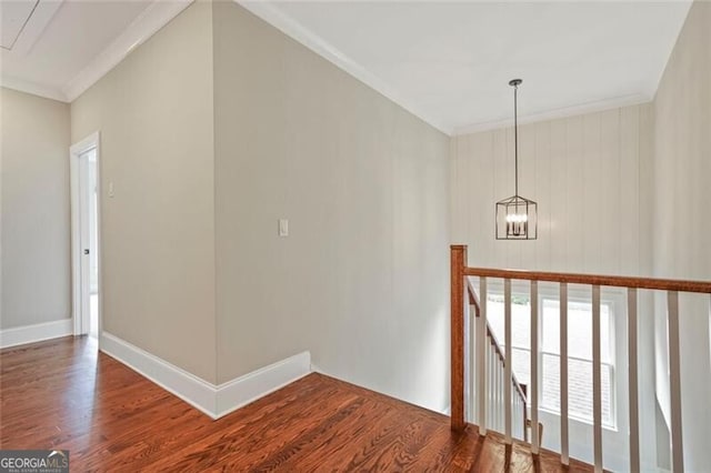 2493 Oostanaula Dr, Brookhaven, GA 30319 - hall featuring an upstairs landing, wood finished floors, crown molding, a chandelier, and baseboards