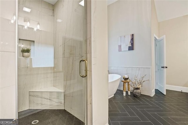 2493 Oostanaula Dr, Brookhaven, GA 30319 - bathroom with a shower stall, a soaking tub, and a wainscoted wall