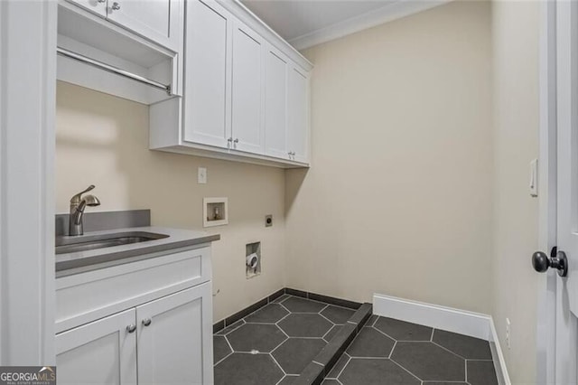 2493 Oostanaula Dr, Brookhaven, GA 30319 - washroom with hookup for an electric dryer, cabinet space, washer hookup, dark tile patterned flooring, and baseboards