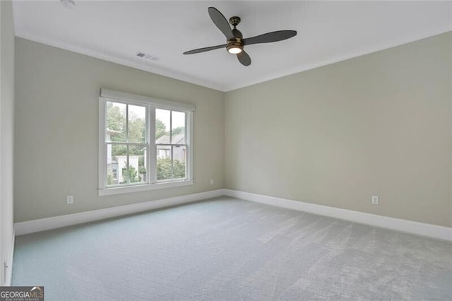 2493 Oostanaula Dr, Brookhaven, GA 30319 - carpeted spare room featuring baseboards, ornamental molding, and ceiling fan