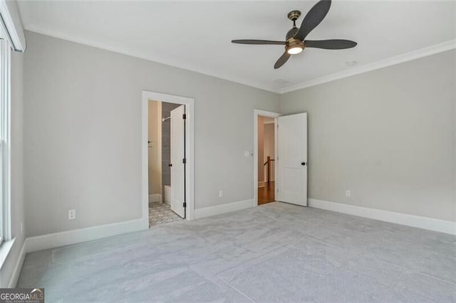 2493 Oostanaula Dr, Brookhaven, GA 30319 - unfurnished bedroom with carpet flooring, crown molding, baseboards, ensuite bathroom, and a ceiling fan