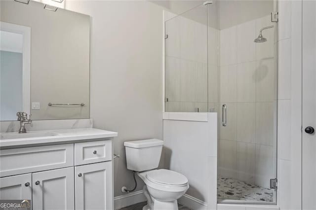 2493 Oostanaula Dr, Brookhaven, GA 30319 - bathroom featuring vanity, toilet, a shower stall, and baseboards