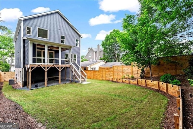 2493 Oostanaula Dr, Brookhaven, GA 30319 - rear view of property featuring stairs, a sunroom, central AC, and a deck