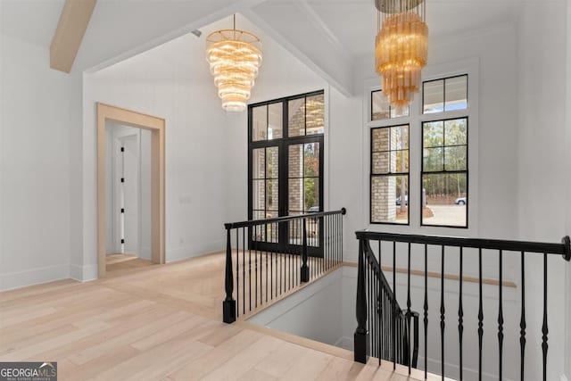 5050 Browns Ford Rd, Greensboro, GA 30642 - corridor with a chandelier, an upstairs landing, wood finished floors, and baseboards