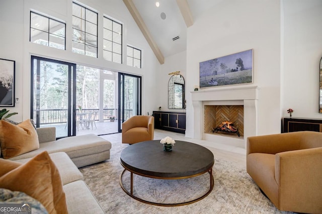 5050 Browns Ford Rd, Greensboro, GA 30642 - living area with high vaulted ceiling, beamed ceiling, and a fireplace with flush hearth