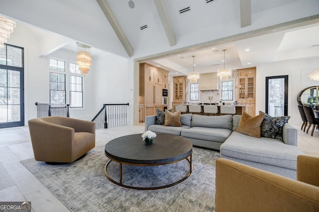 5050 Browns Ford Rd, Greensboro, GA 30642 - living area featuring a chandelier, a tray ceiling, and healthy amount of natural light
