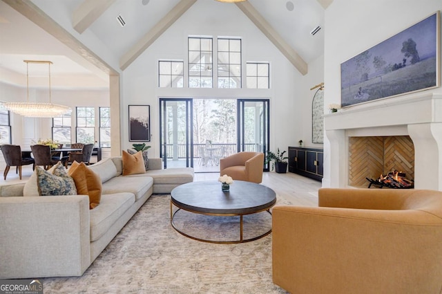 5050 Browns Ford Rd, Greensboro, GA 30642 - living room featuring high vaulted ceiling, light wood-style floors, and beam ceiling