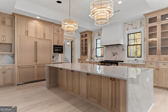 5050 Browns Ford Rd, Greensboro, GA 30642 - kitchen with a tray ceiling, a chandelier, a large island, premium range hood, and tasteful backsplash