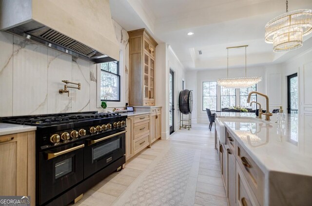 5050 Browns Ford Rd, Greensboro, GA 30642 - kitchen with double oven range, a chandelier, premium range hood, a tray ceiling, and healthy amount of natural light
