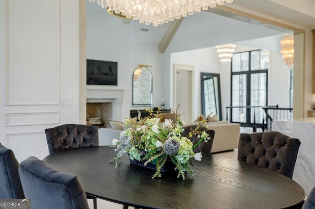5050 Browns Ford Rd, Greensboro, GA 30642 - dining room featuring a chandelier and a fireplace