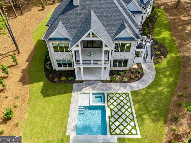 5050 Browns Ford Rd, Greensboro, GA 30642 - back of property featuring a shingled roof, a balcony, board and batten siding, and a yard