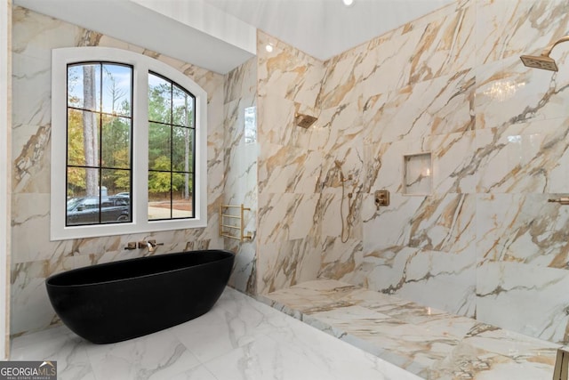 5050 Browns Ford Rd, Greensboro, GA 30642 - full bathroom featuring a freestanding tub, tile walls, marble tiled floors, stone wall, and a marble finish shower