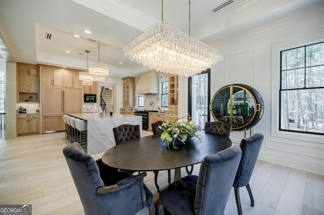 5050 Browns Ford Rd, Greensboro, GA 30642 - dining room featuring a chandelier, light wood-type flooring, recessed lighting, and a tray ceiling