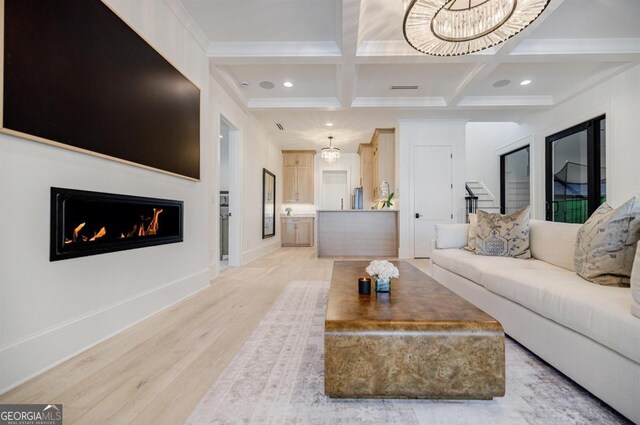 5050 Browns Ford Rd, Greensboro, GA 30642 - living area with coffered ceiling, light wood-style floors, beamed ceiling, a warm lit fireplace, and baseboards