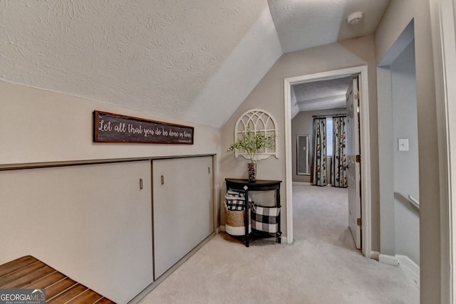 3694 Jay Bird Aly, Peachtree Corners, GA 30092 - hallway with lofted ceiling, light carpet, a textured ceiling, and baseboards